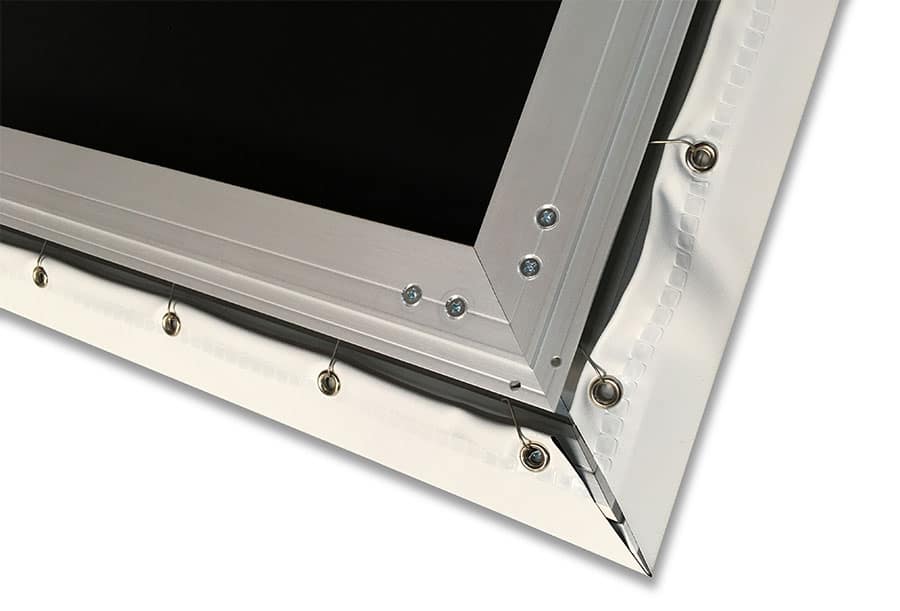 Close-up of a metallic frame with screws on a white background