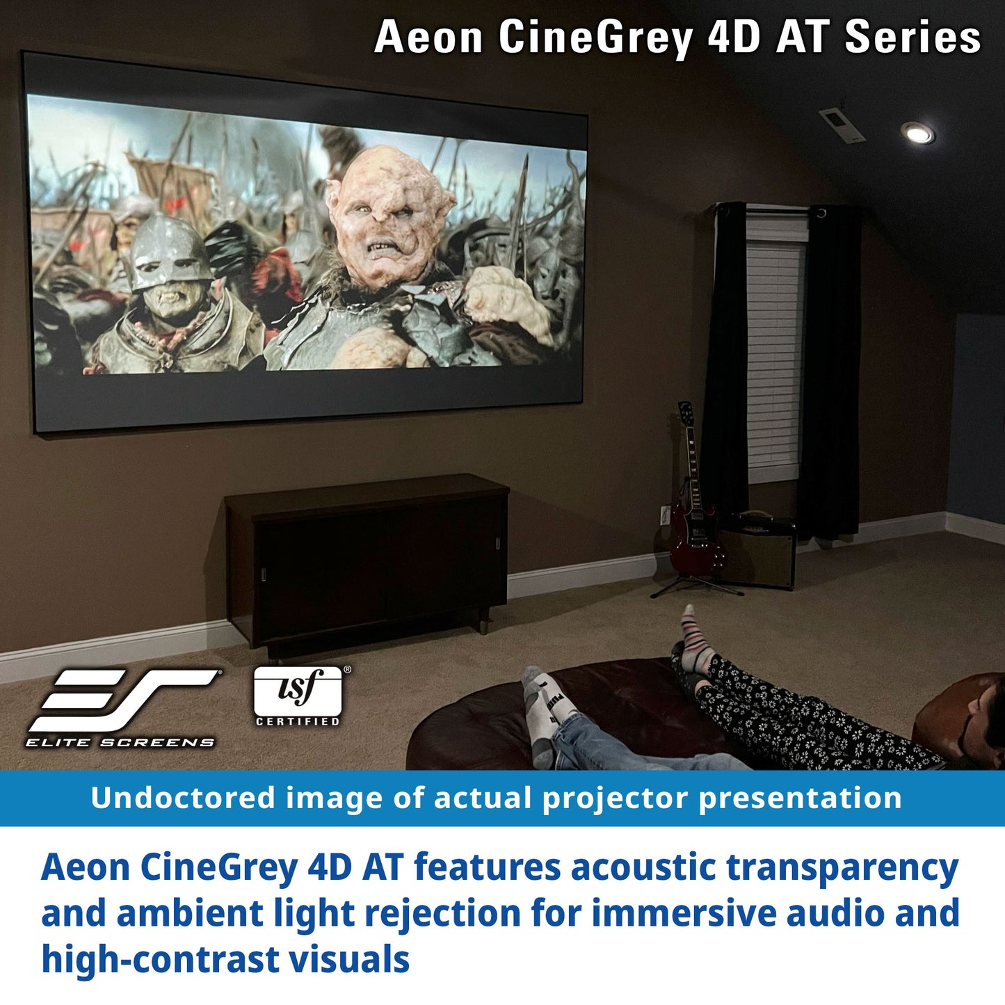 Home theater setup with a large screen displaying a movie scene, featuring Elite Screens and SJF logos.
