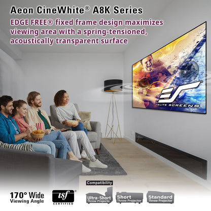 Living room with people watching a movie on a large screen, featuring Aeon CineWhite A8K Series technology.