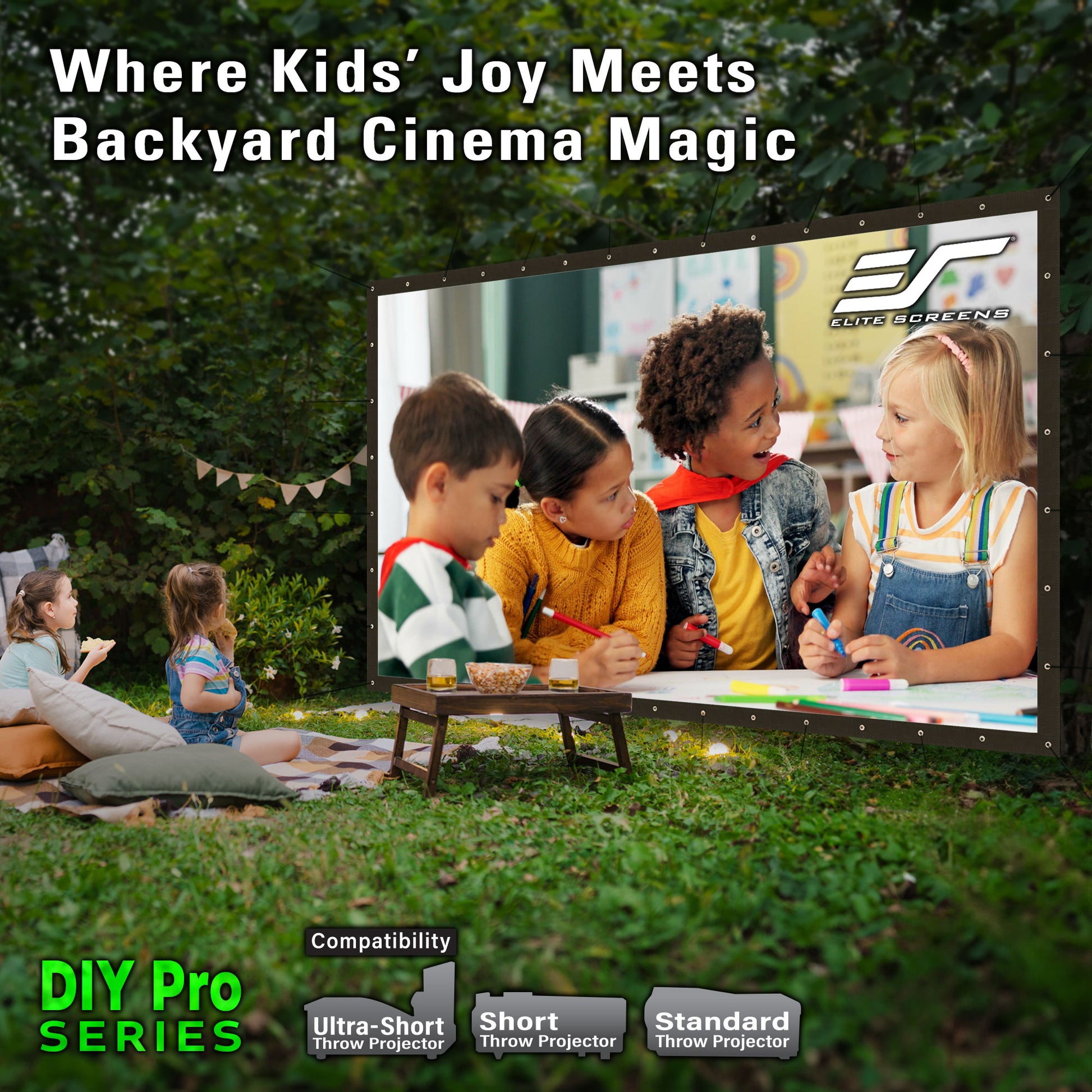 Children watching a movie on an outdoor screen with Evergreen Films logo.
