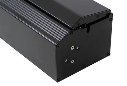 Black metal box with a ribbed surface on a white background