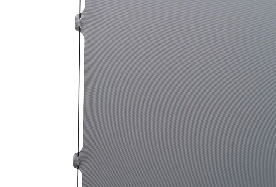 Close-up of a textured gray panel with a white background