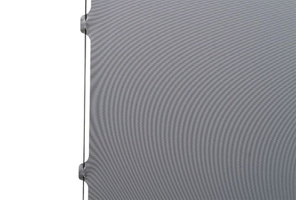 Close-up of a textured gray panel with a white background
