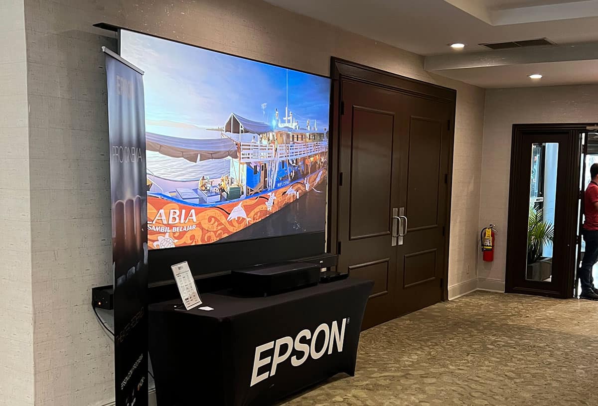 Epson projector screen displaying a presentation in an indoor setting