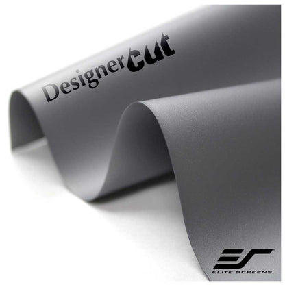 A close-up of a rolled gray film or vinyl sheet with the words 'DesignerCut' printed on it and an 'Elite Screens' logo in the lower right corner, photographed on a white background.
