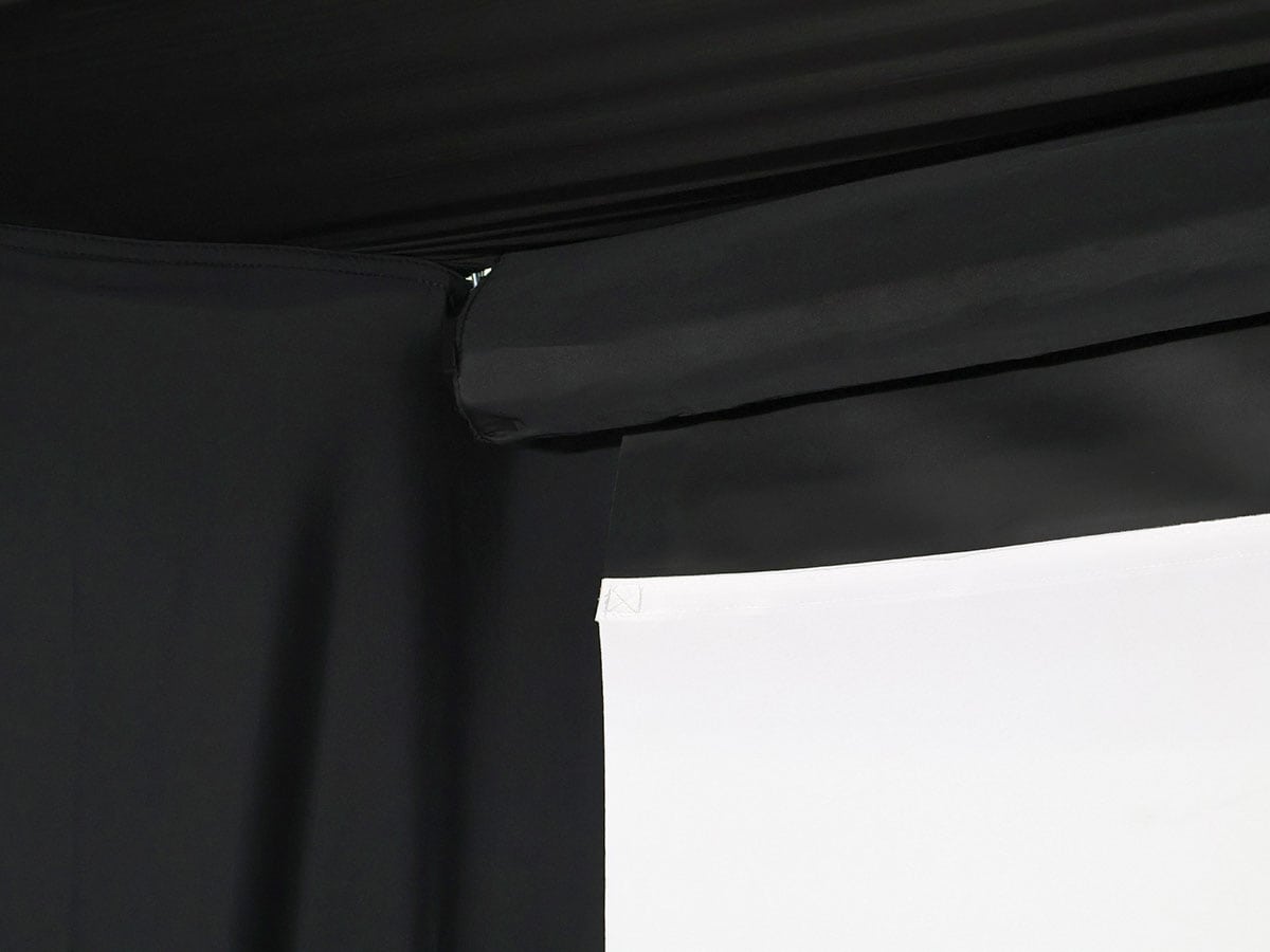 Close-up of a black curtain with a white background