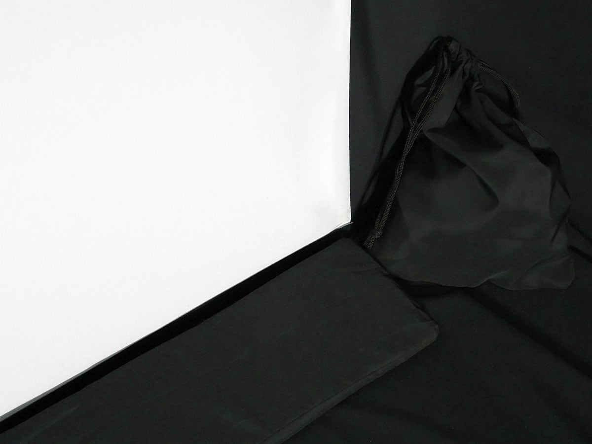 Black fabric draped over a white surface