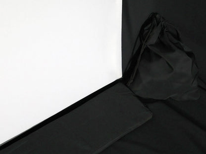 Black fabric draped over a white surface