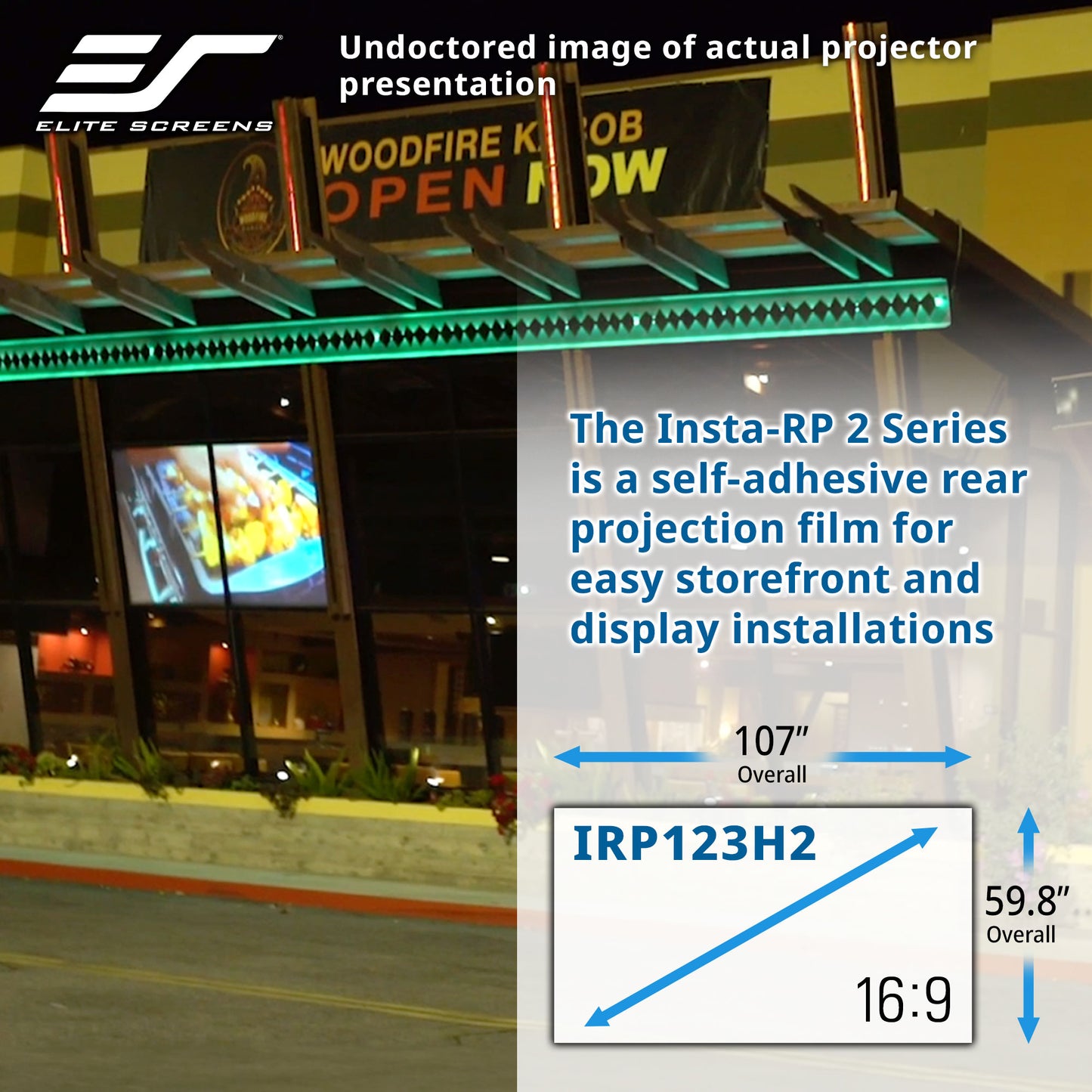 Elite Screens projector screen with text and measurements on a storefront background