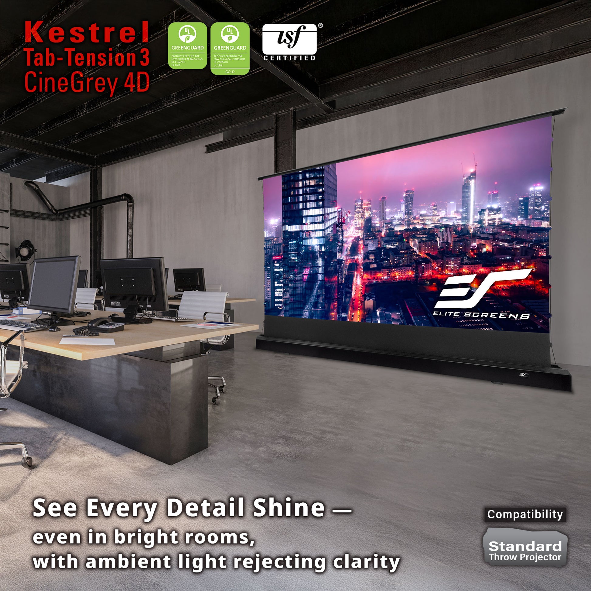 Large projection screen in an office setting with computer monitors, displaying Elite Screens branding.