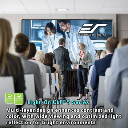 People in a conference room watching a presentation on an Elite Screens display.