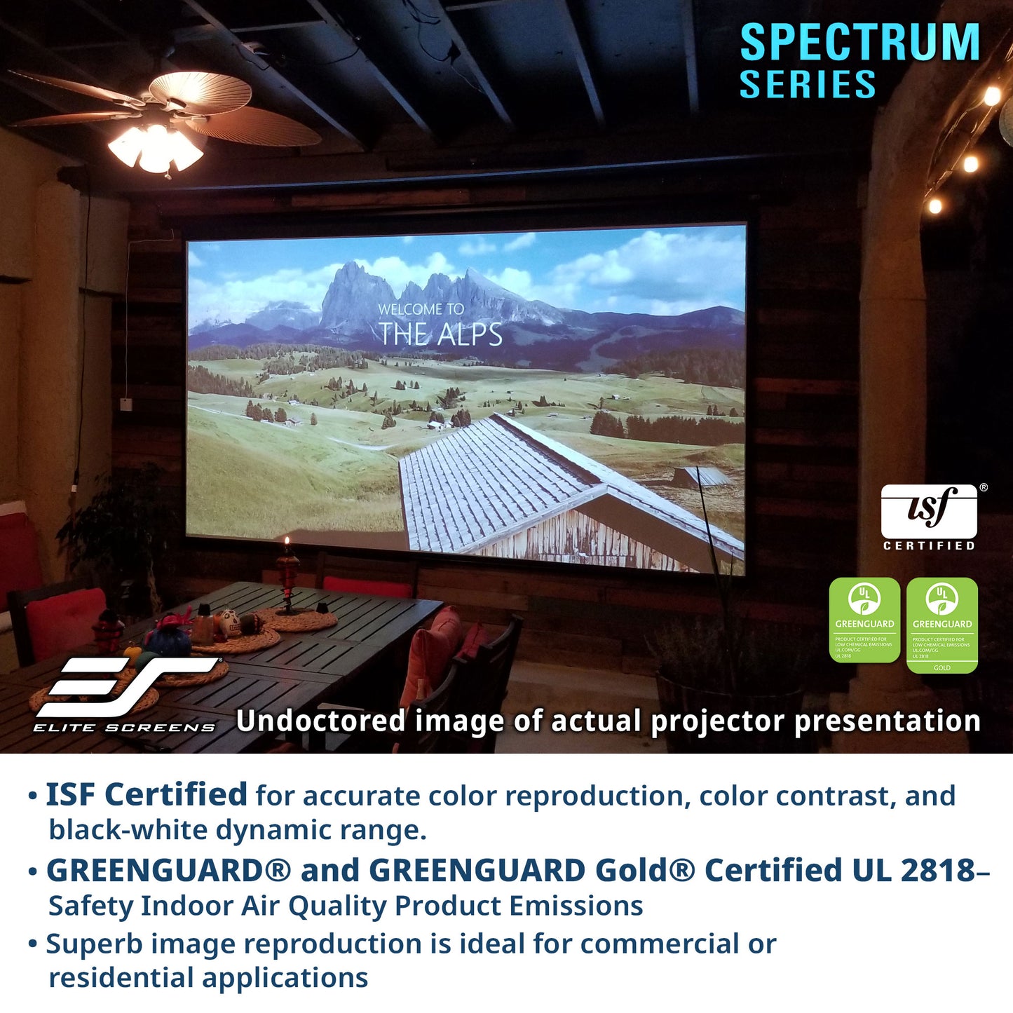 Projector screen displaying a scenic landscape with ISF and GreenGuard certification logos, in a home theater setting.