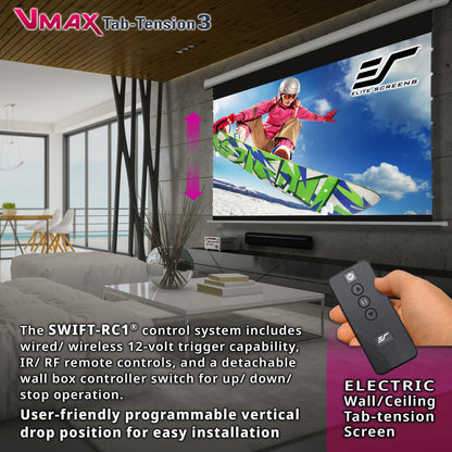 Living room setup with electric wall/ceiling tab-tension screen and remote control, featuring VMAX Tab-Tension 3 branding.