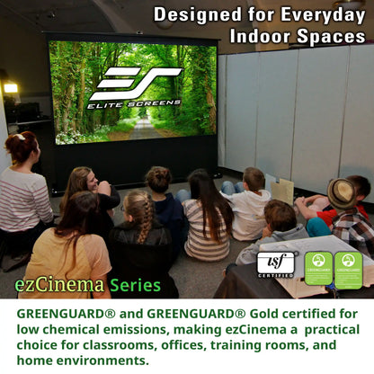 A group of children sitting on the floor watching a movie on a large screen in a classroom or auditorium. The screen displays the Elite Screens logo.