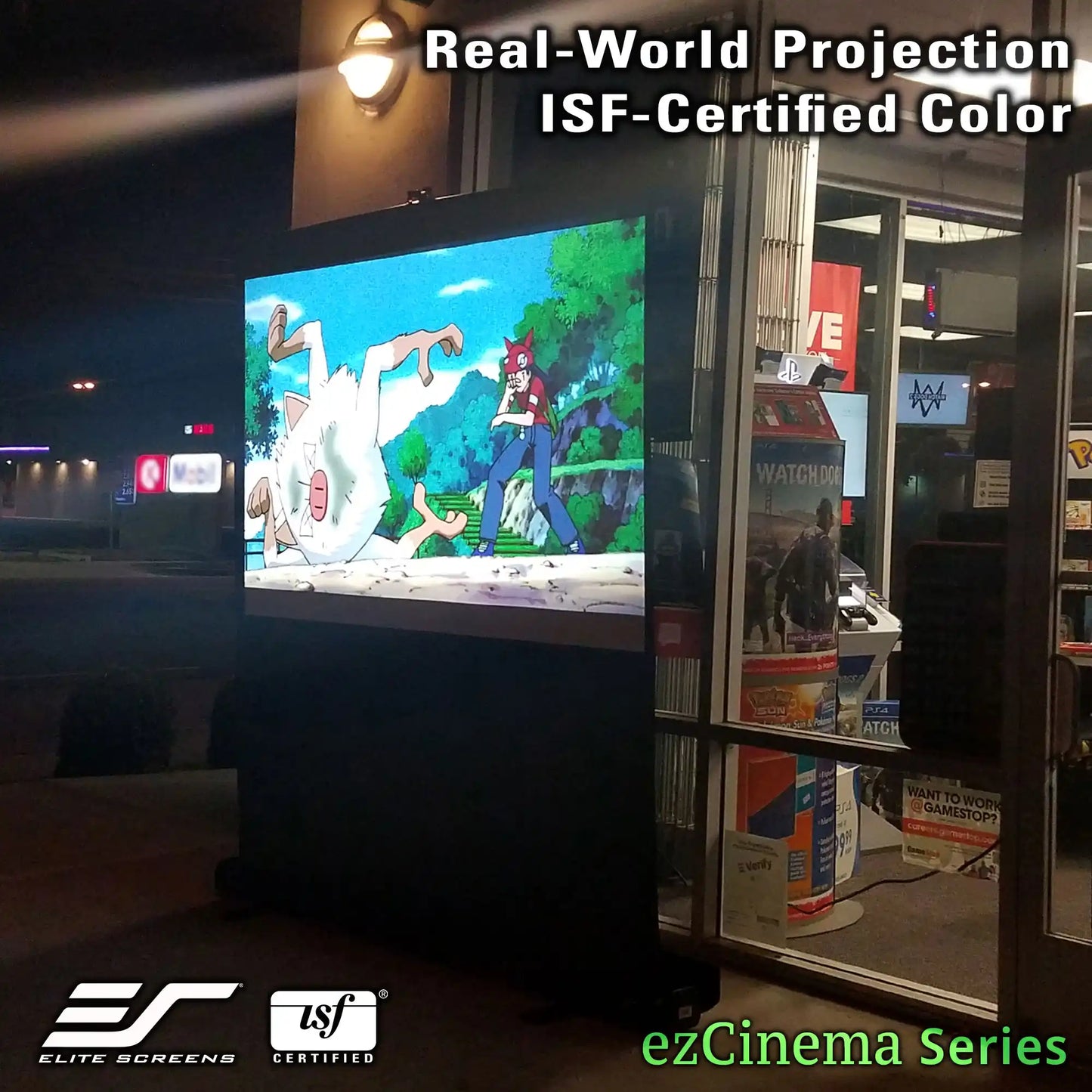 A large freestanding cinema screen displaying an anime scene at night outside a store. Text overlays read 'Real-World Projection', 'ISF-Certified Color', and 'ezCinema Series', with Elite Screens and ISF certification logos at the bottom.
